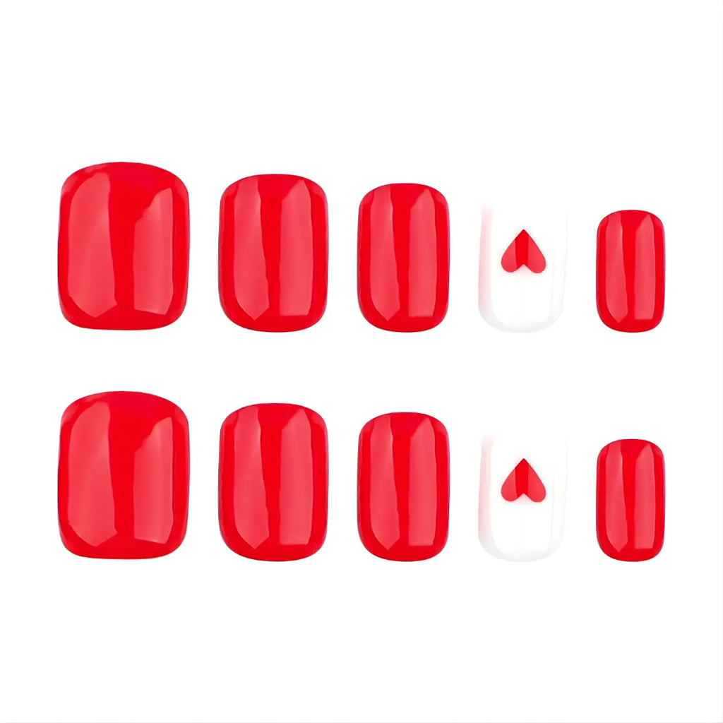 Short solid red press-on  nails with a heart accent 
