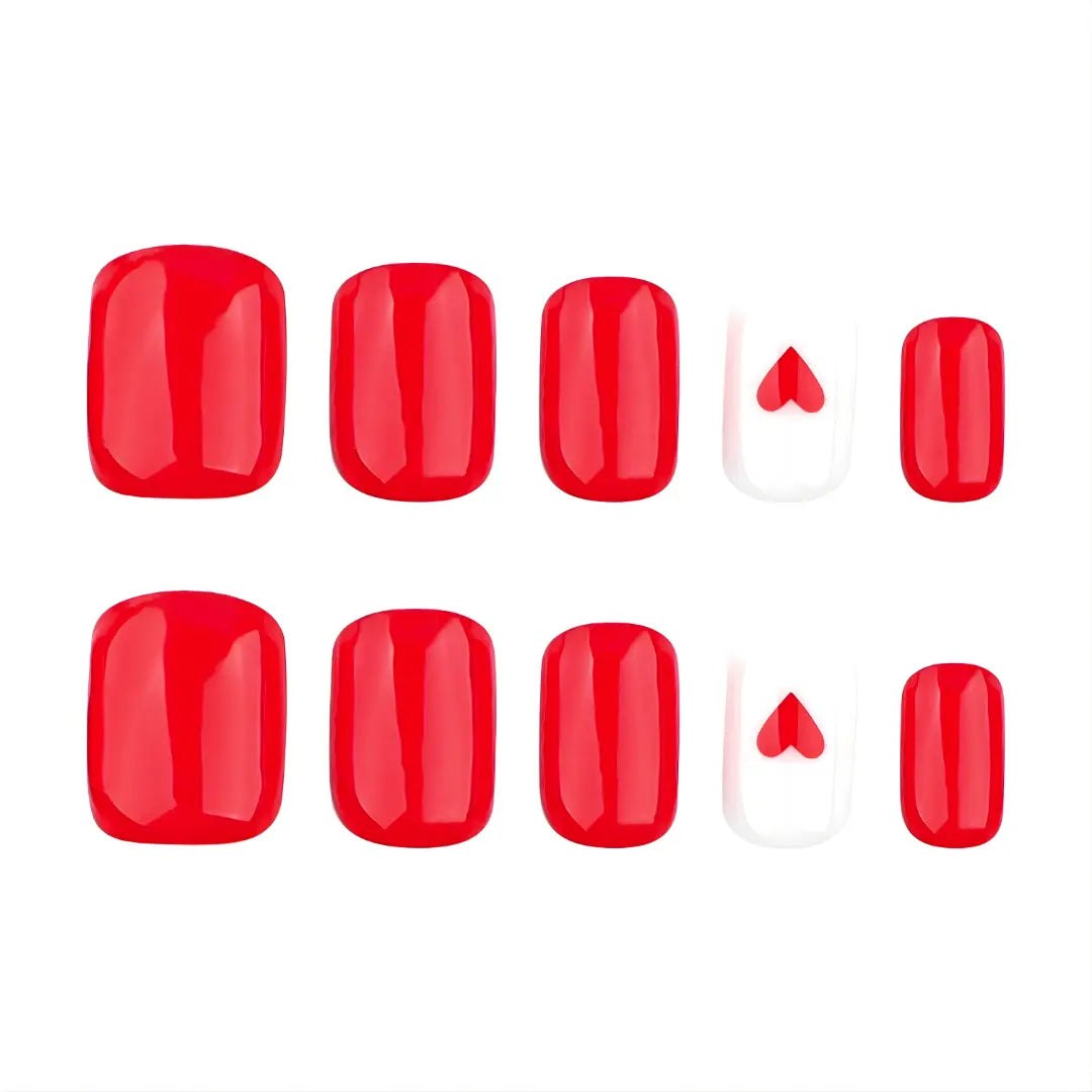 Short solid red press-on  nails with a heart accent 