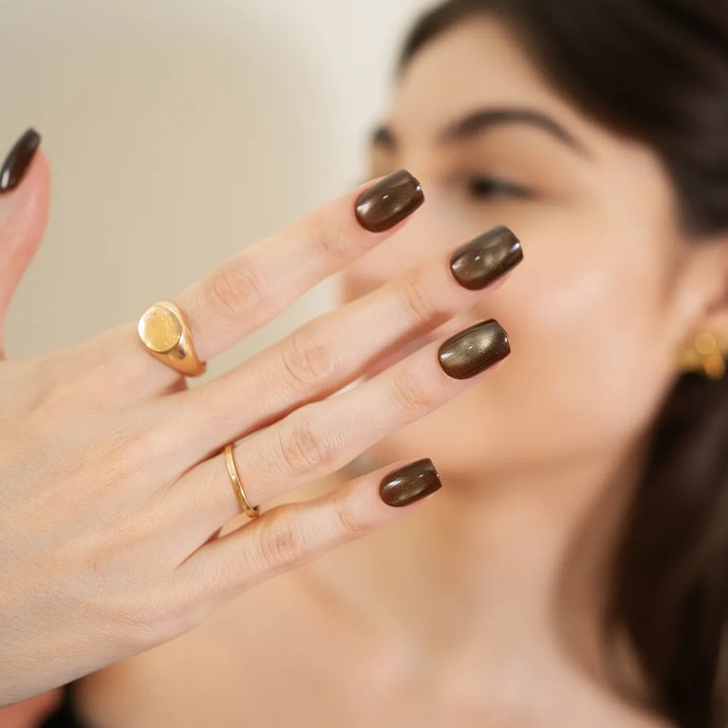 Metallic bronze chrome press-on nails with glossy finish in a medium square-oval shape by Soul Struck