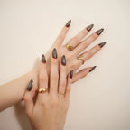 Long almond-shaped brown ombré press-on nails with a glossy gradient finish