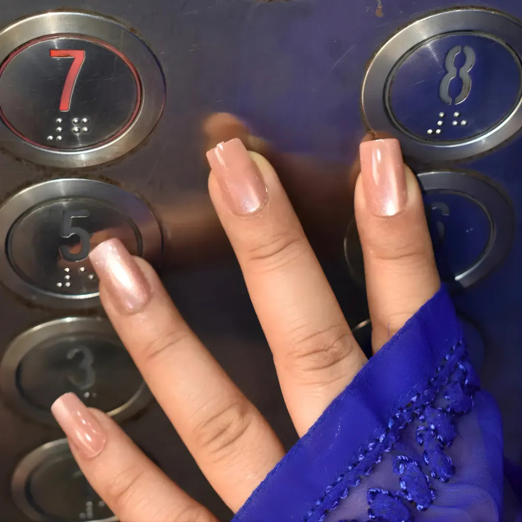 Luxury rose gold press-on nails with a reflective chrome finish and short square shape for a flawless professional manicure by Soul Struck