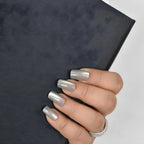 Reusable silver -grey cat eye press-on nails featuring a glossy chrome finish in a short square shape by Soul Struck