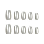 Luxury silver metallic press-on nails with a glossy cat eye design and reusable salon-quality finish by oul Struck