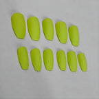 Solid matte kiwi green press-on nails in an square shape with a soft velvety finish.