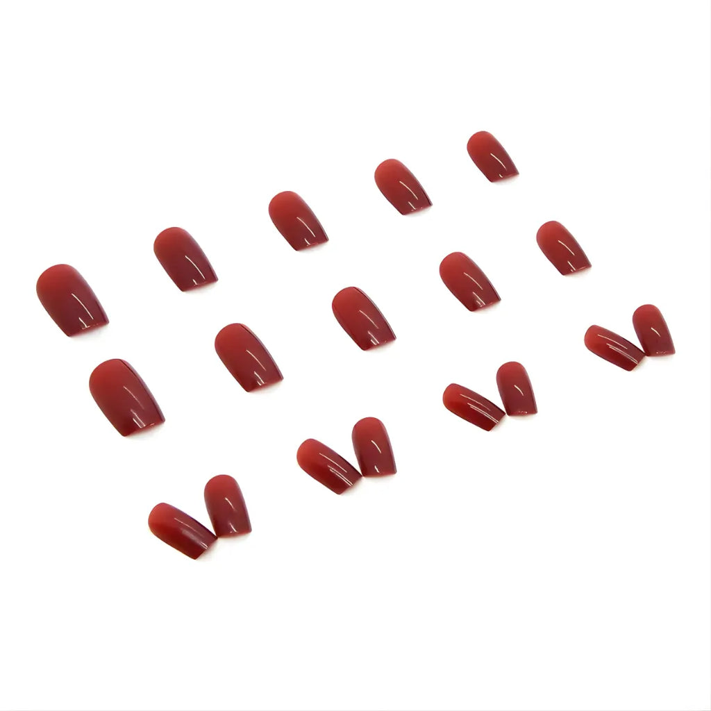 Elegant red square press-on nails with a high-gloss finish, reusable false nails for a professional manicure at home.