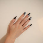 "Premium matte black cat eye press-on nails in a long almond shape with a metallic shimmer finish for a bold, salon-quality look."