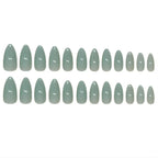 Glossy sage green press-on nails in almond shape, reusable fake nails with salon-quality finish.