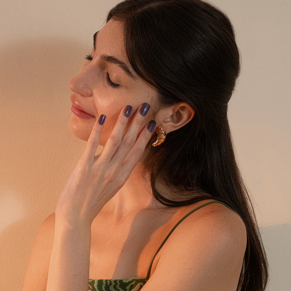 Short square-shaped slate blue shimmer press-on nails with a glossy salon-quality finish