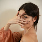Long almond-shaped nude taupe press-on nails with dark brown angled French tips by Soul Struck