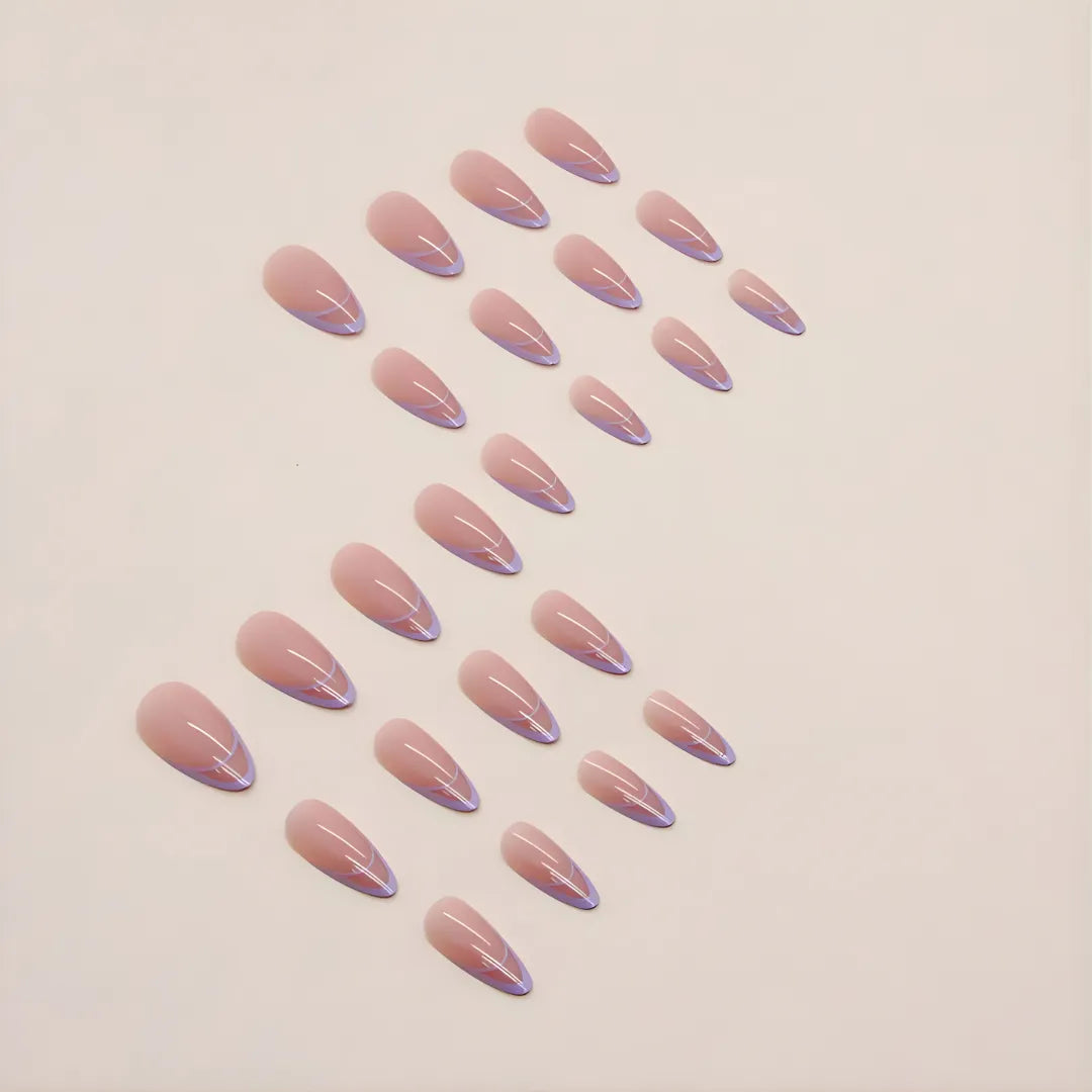 Lavender almond-shaped press-on nails with glossy finish and subtle curved detailing, reusable fake nails and easy stick-on nail extensions for women by Soul Struck