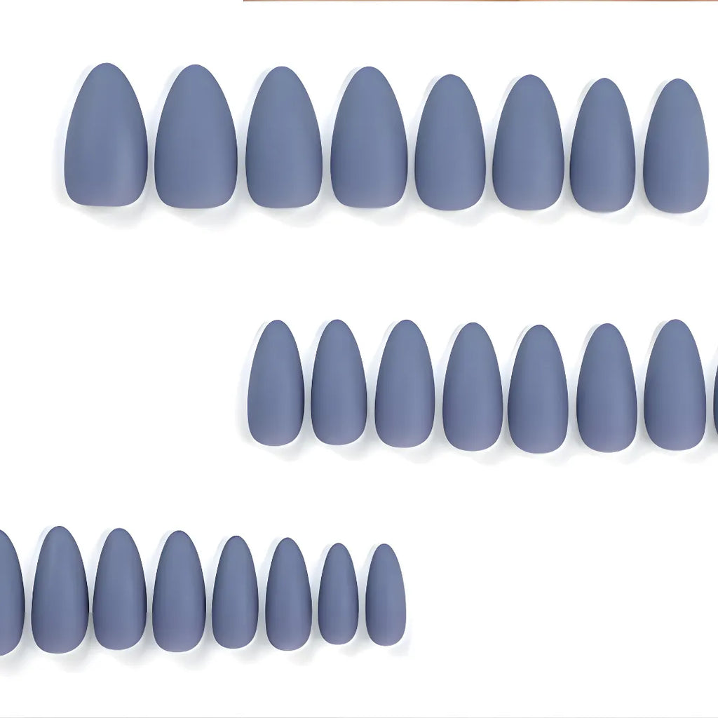 Matte slate blue almond-shaped press-on nails with a smooth salon-quality finish by Soul Struck