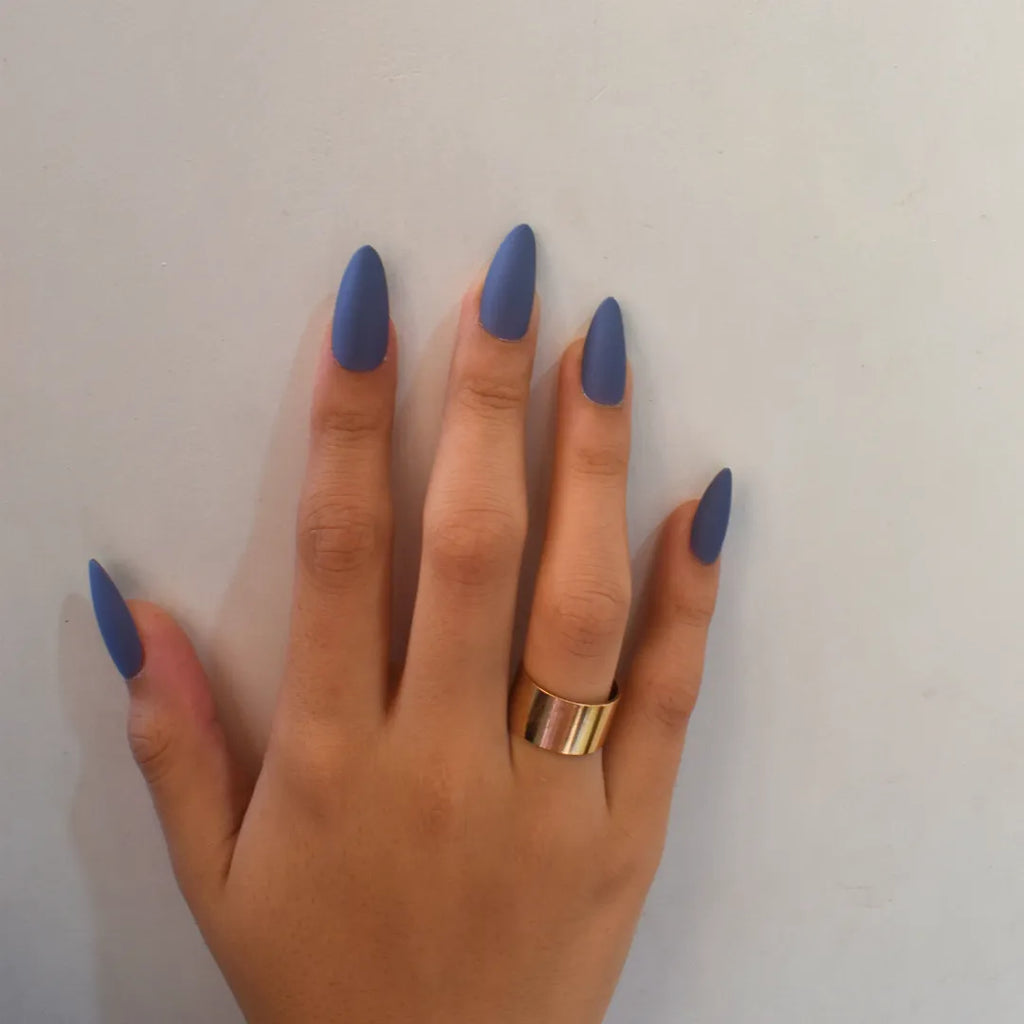 Reusable matte blue press-on nails with an almond shape and salon-quality finish by Soul Struck.