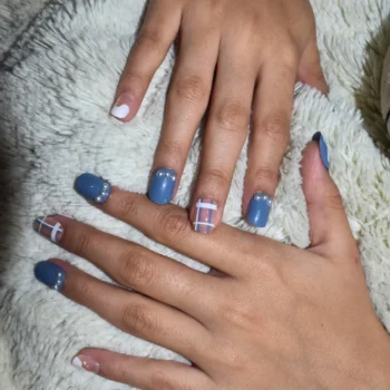 Blue press-on nails in a sleek, glossy finish displayed for a stylish and modern look.